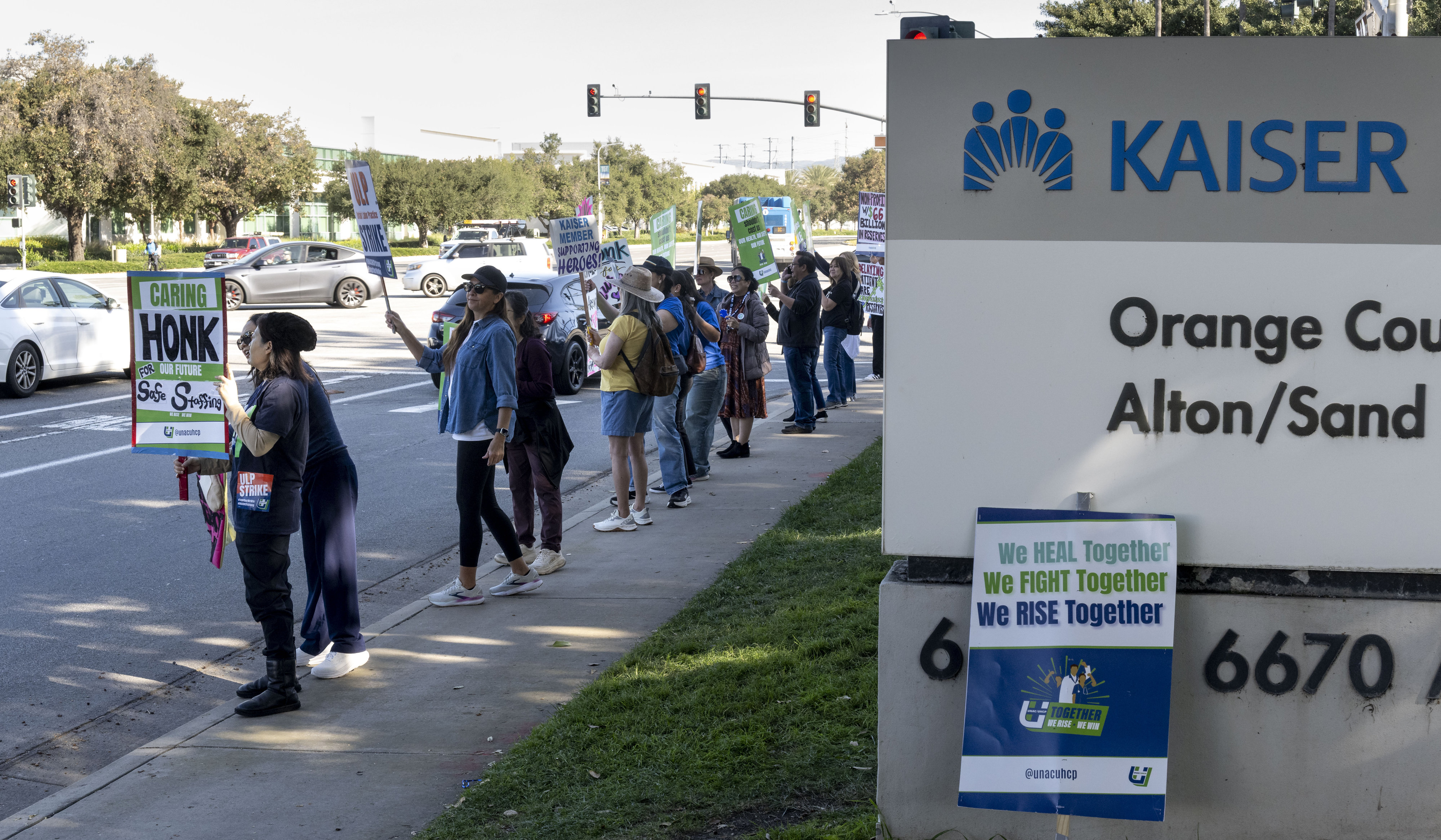 Workers protest at Kaiser Permanente on Alton Pkwy. in Irvine,...