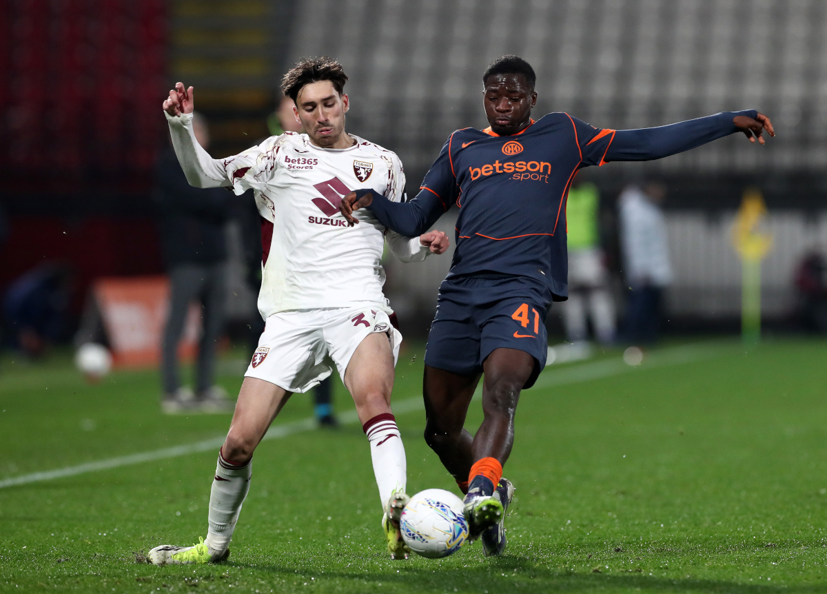 MONZA, ITALY - FEBRUARY 04: Rafael Obrador of Torino battles for possession with Issiaka Kamate of FC Internazionale Milano during the Coppa Italia Quarter-Final match between FC Internazionale and Torino at U-Power Stadium on February 04, 2026 in Monza, Italy. (Photo by Marco Luzzani/Getty Images)