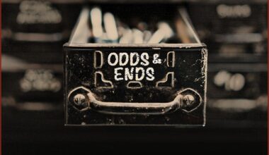 Odds and ends - a black and white image of a drawer with a sign that reads 'odds & ends'.