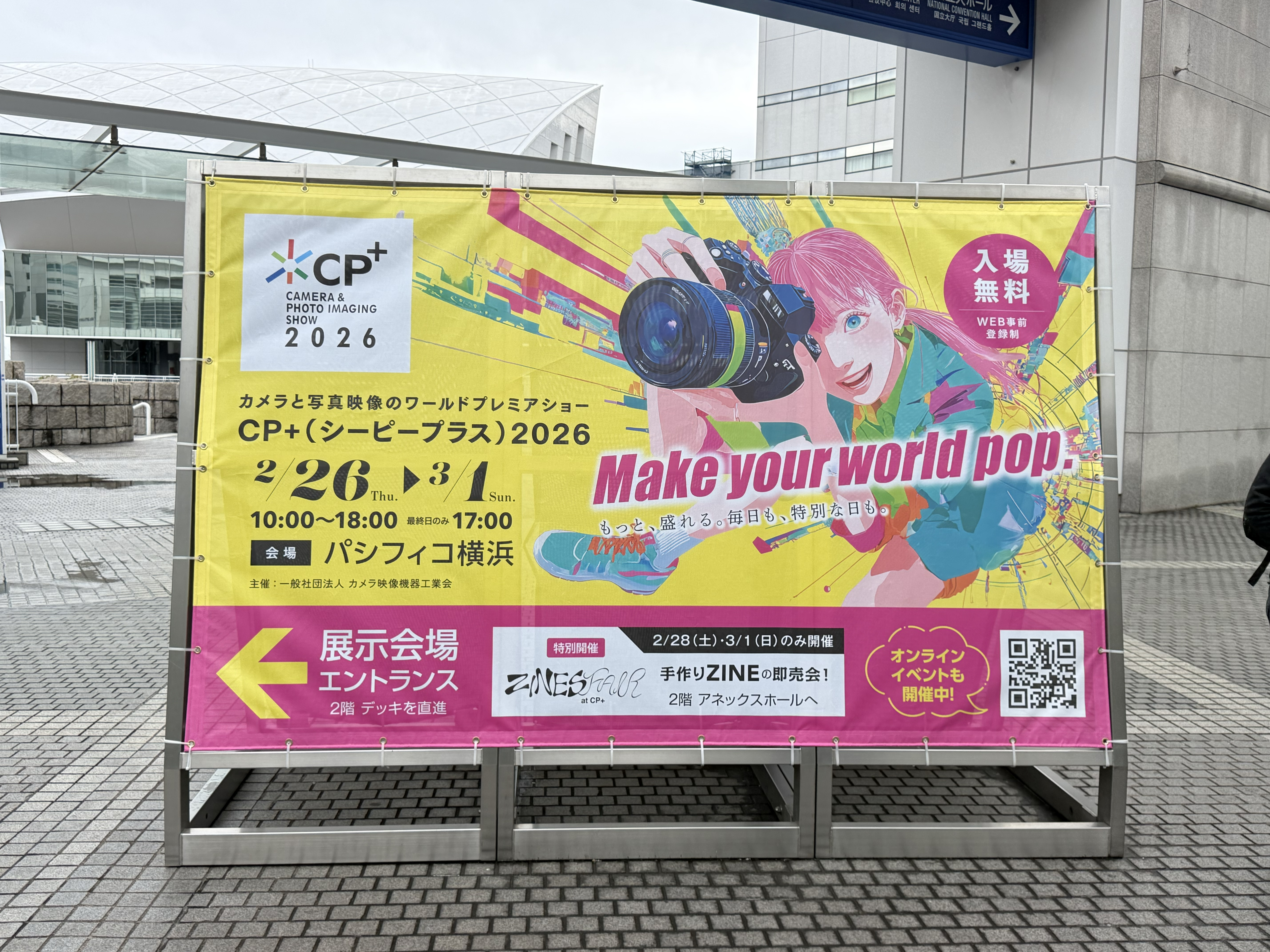 A colorful welcome sign outside of the CP+ 2026 photography show in Tokyo, Japan