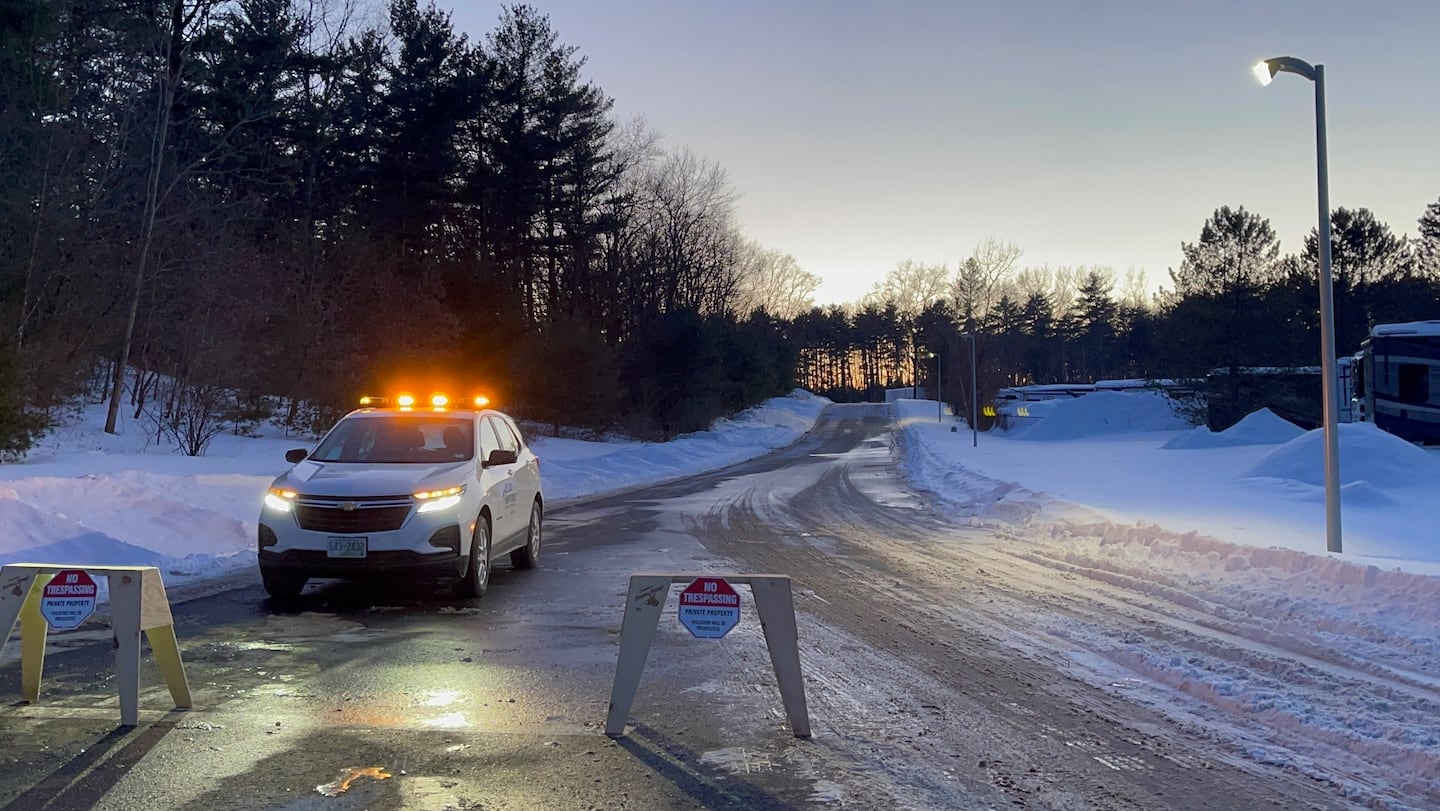 "No trespassing” signs and a private security guard blocked the driveway to a warehouse in Merrimack, N.H., where ICE considered potential plans for a detention facility.