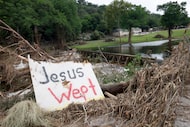 A sign that reads, “ Jesus Wept,” is seen near Camp Mystic, Wednesday, July 9, 2025, in Hunt. 