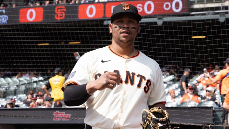 San Francisco Giants first baseman Rafael Devers walks onto the field before an MLB baseball game against the Colorado Rockies, Saturday, Sept. 27, 2025, in San Francisco.