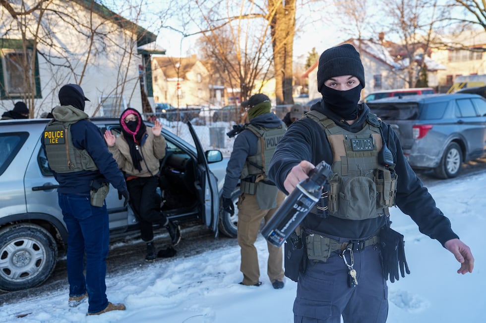 Activists are approached by federal agents for following agent vehicles, on Tuesday, Feb. 3,...