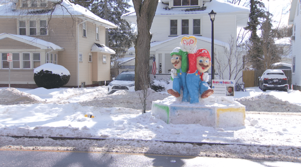 Artist creates Mario and Luigi snow sculpture outside of Golisano Children's Hospital
