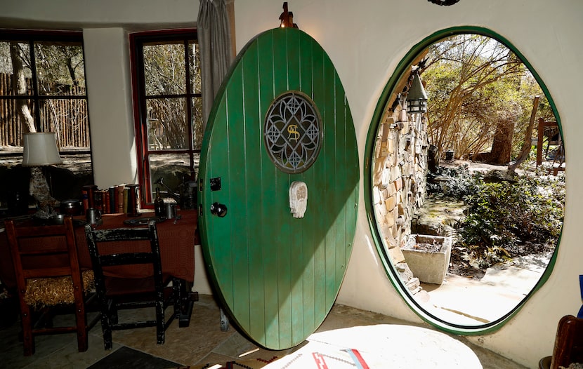 The green front door of the hobbit-styled guest cottage.