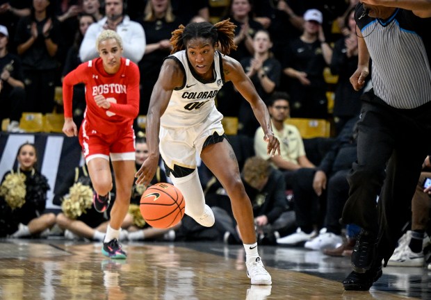 Jaylyn Sherrod (0) of the Colorado Buffaloes runs in transition ahead of Kelsi Mingo (3) of the Boston University Terriers during the fourth quarter of CU's 85-55 win at the CU Events Center in Boulder on Tuesday, Nov. 28, 2023. (Photo by AAron Ontiveroz/The Denver Post)