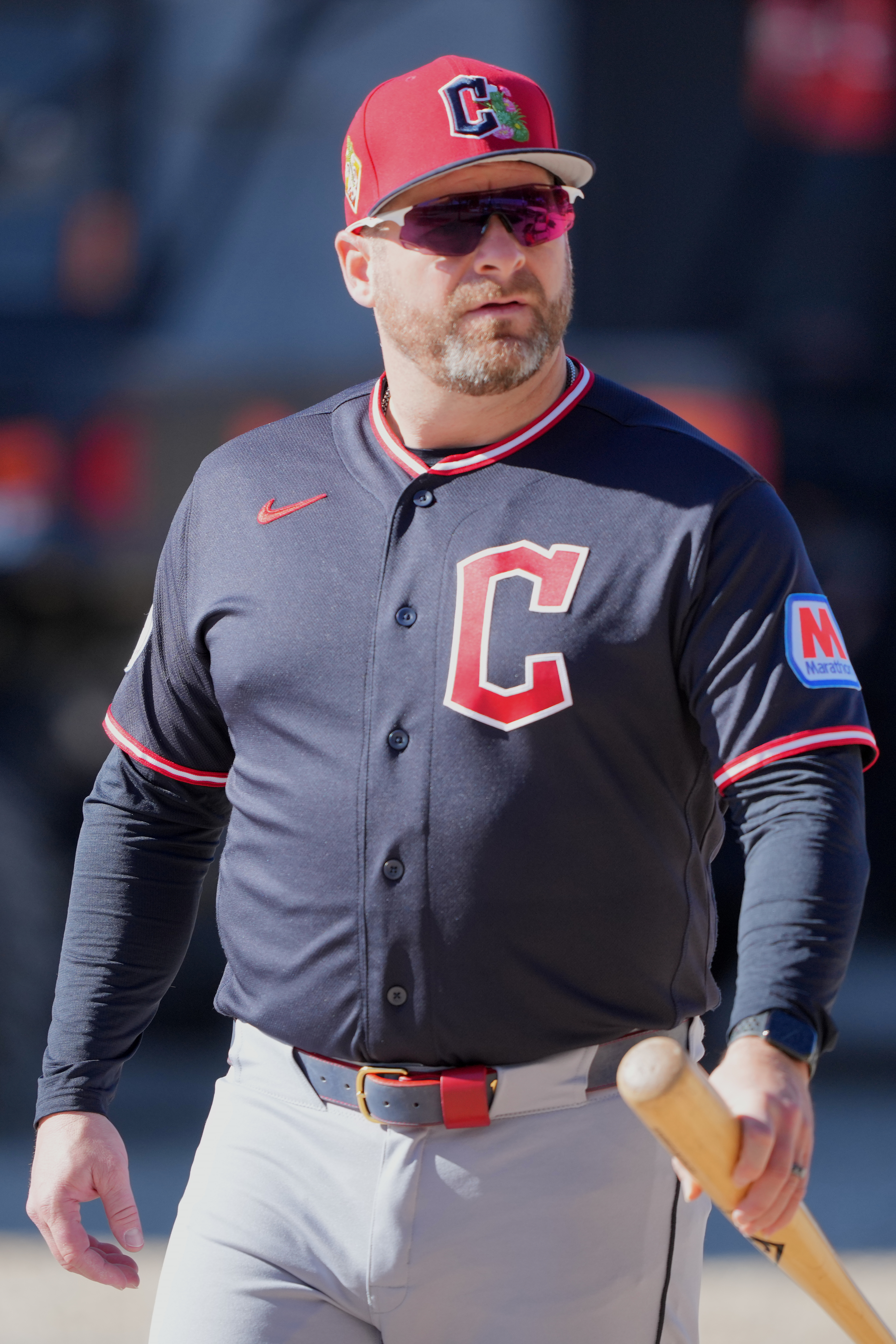 Cleveland Guardians manager Stephen Vogt watches work outs during spring...