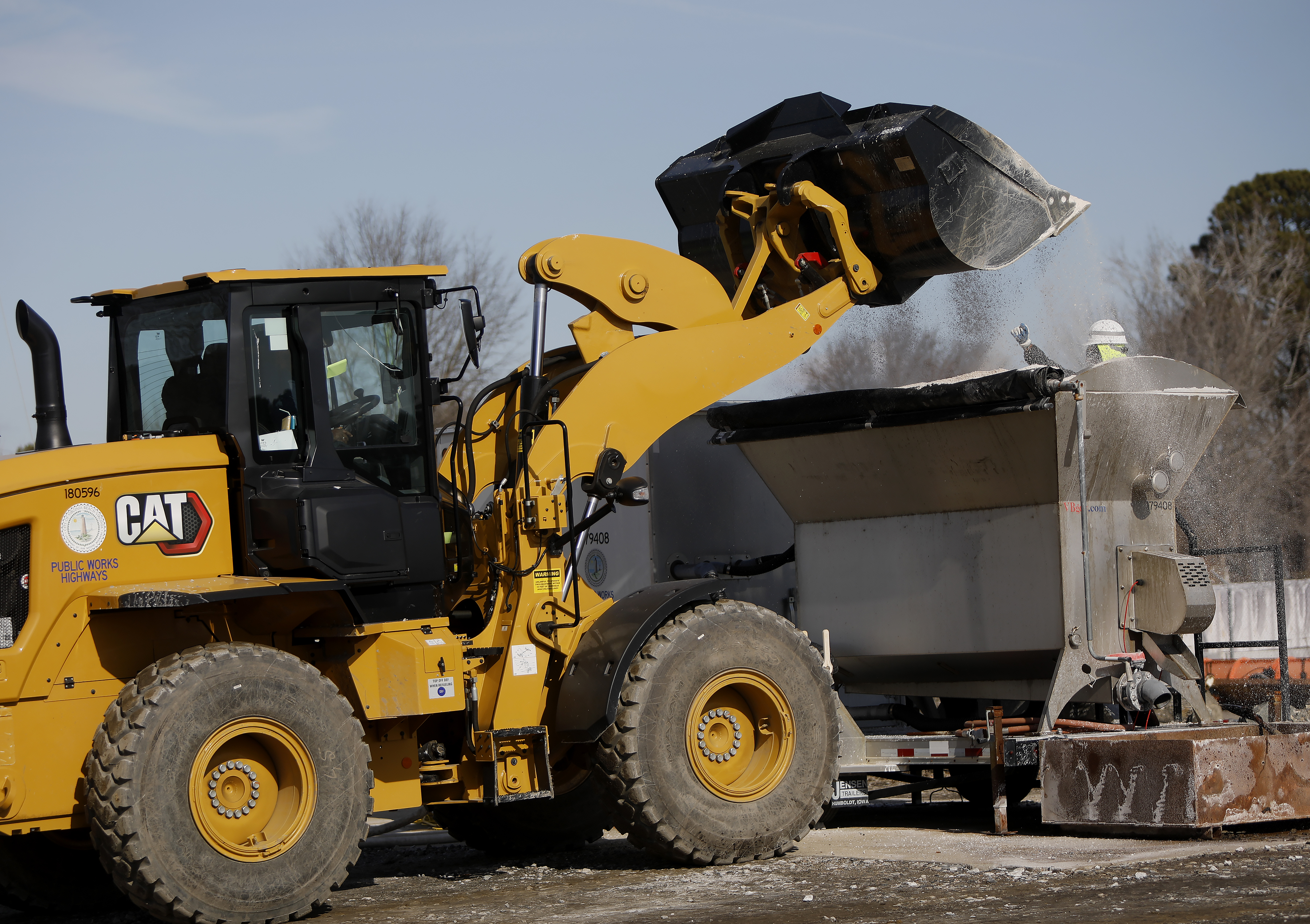Virginia Beach Public Works employees prepare brine to be spread...