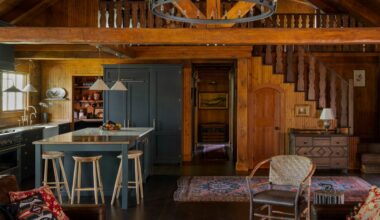 A pair of log cabins on a remote Minnesota island, decorated with an elegant European sensibility