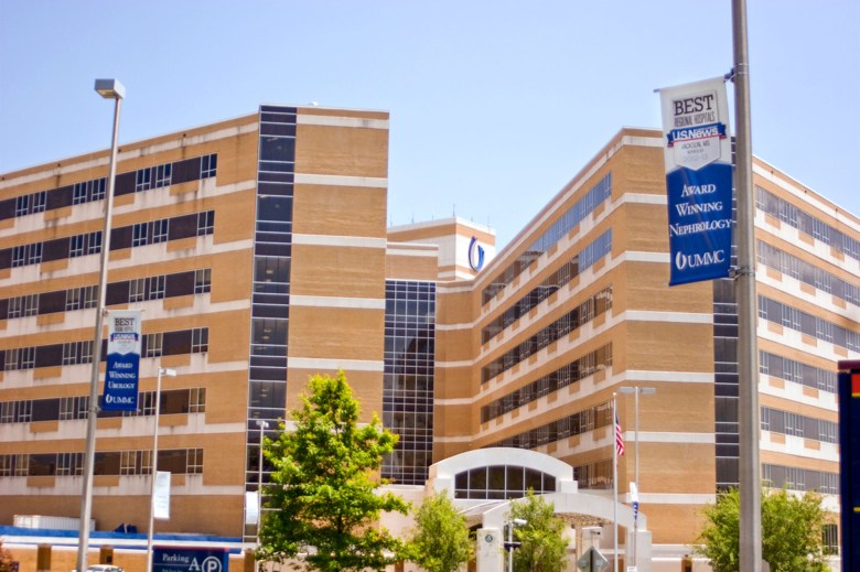 An exterior view of the UMMC hospital campus with multistory brown and white brick buildings