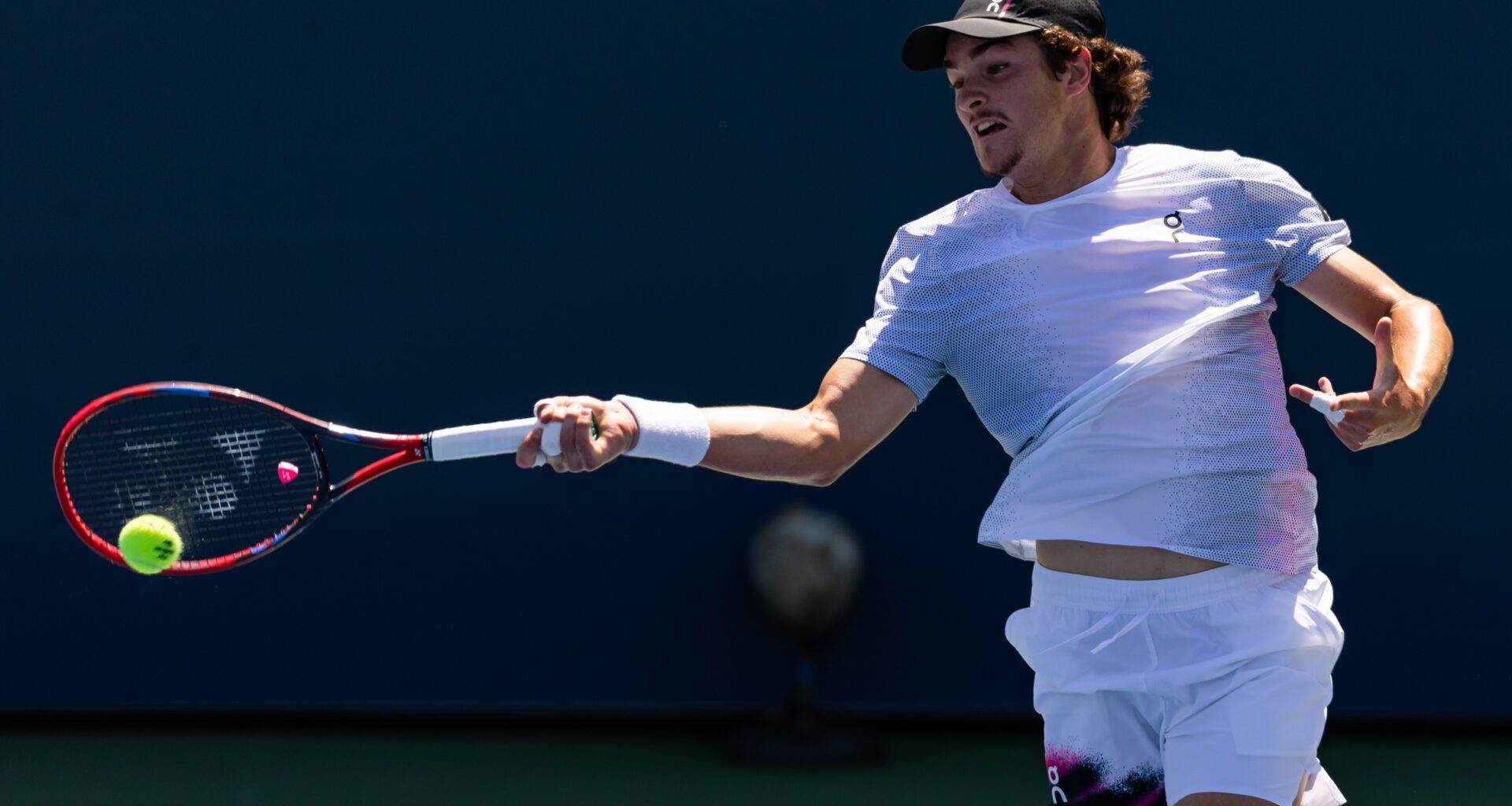 Joao Fonseca hits a forehand against Miomir Kecmanovic at the 2025 US Open.