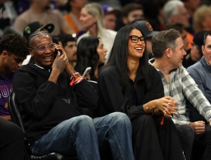 Nov 6, 2025; Phoenix, Arizona, USA; Phoenix Mercury forward Natasha Mack (left) and Satou Sabally sit court side of the Phoenix Suns game against the Los Angeles Clippers at the Mortgage Matchup Center. Mandatory Credit: Mark J. Rebilas-Imagn Images
