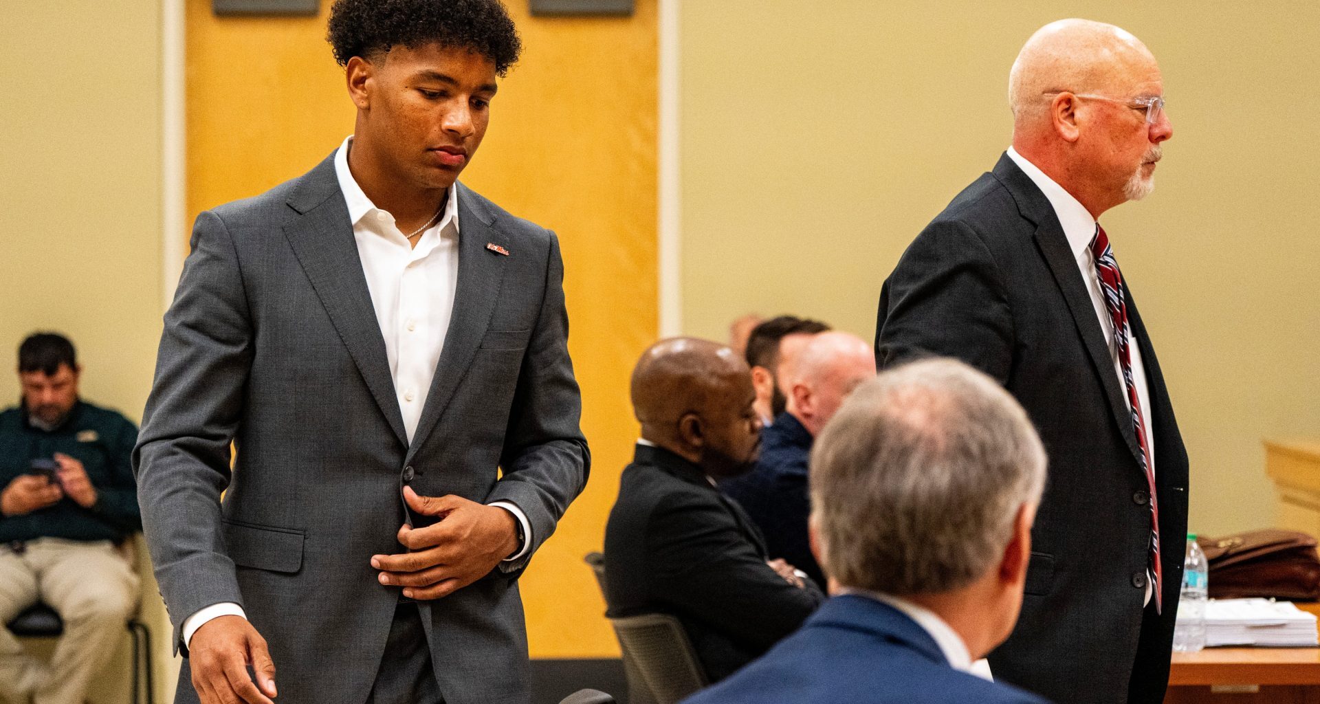 Ole Miss quarterback Trinidad Chambliss returns to his seat after testifying during the hearing in his lawsuit against the NCAA at Calhoun County Courthouse in Pittsboro, Miss., on Thursday, Feb. 12, 2026. Chambliss is looking for a temporary injunction and a permanent injunction against the NCAA for one more year of eligibility.