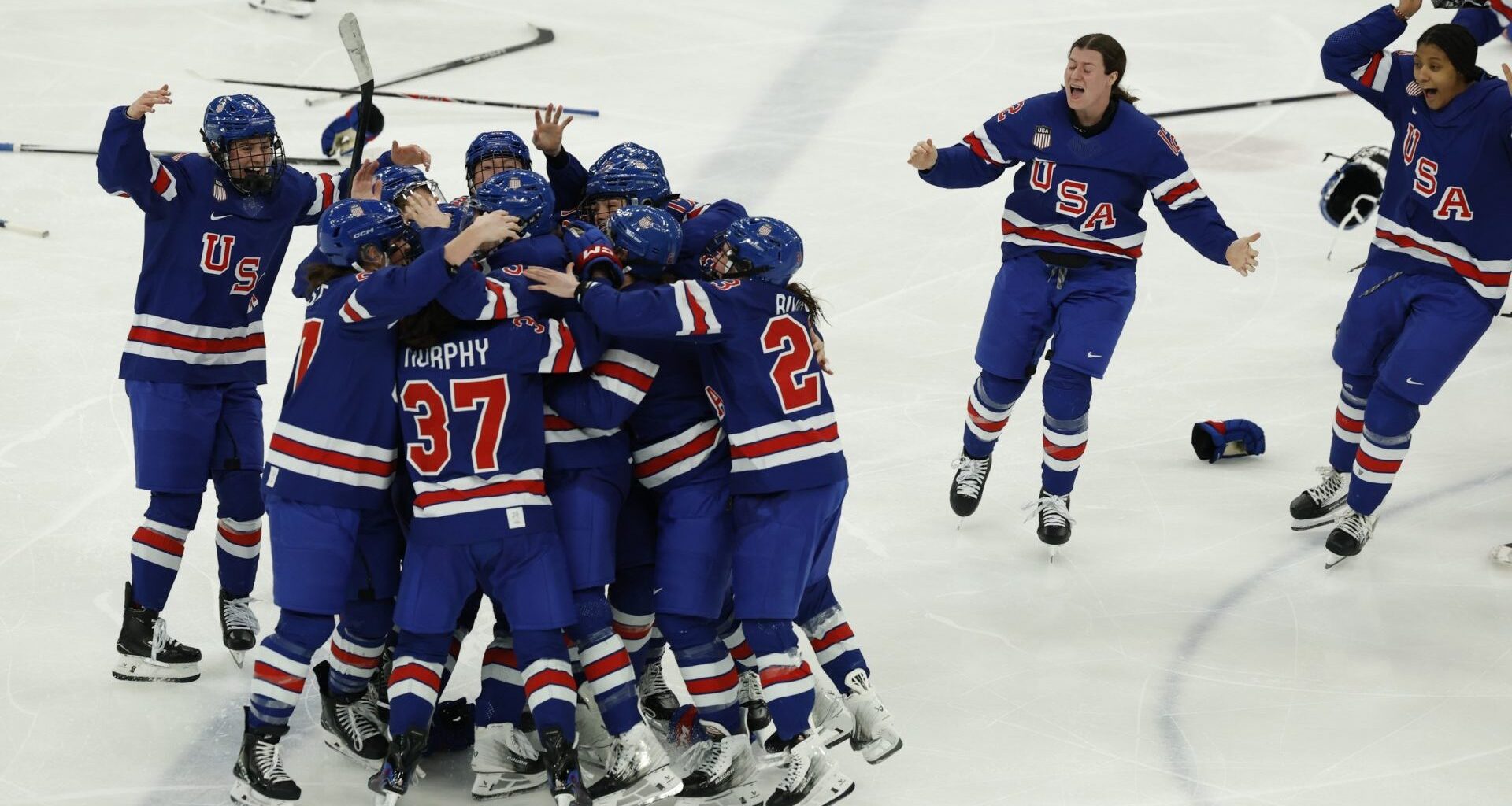 Feb 19, 2026; Milan, Italy; Team USA celebrates winning the gold medal in women’s ice hockey against Canada in overtime during the Milano Cortina 2026 Olympic Winter Games at Milano Santagiulia Ice Hockey Arena. Mandatory Credit: Geoff Burke-Imagn Images