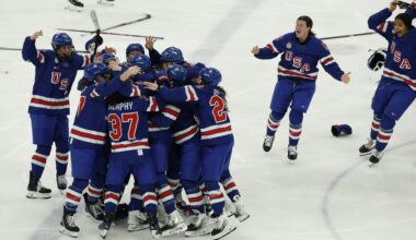 Feb 19, 2026; Milan, Italy; Team USA celebrates winning the gold medal in women’s ice hockey against Canada in overtime during the Milano Cortina 2026 Olympic Winter Games at Milano Santagiulia Ice Hockey Arena. Mandatory Credit: Geoff Burke-Imagn Images