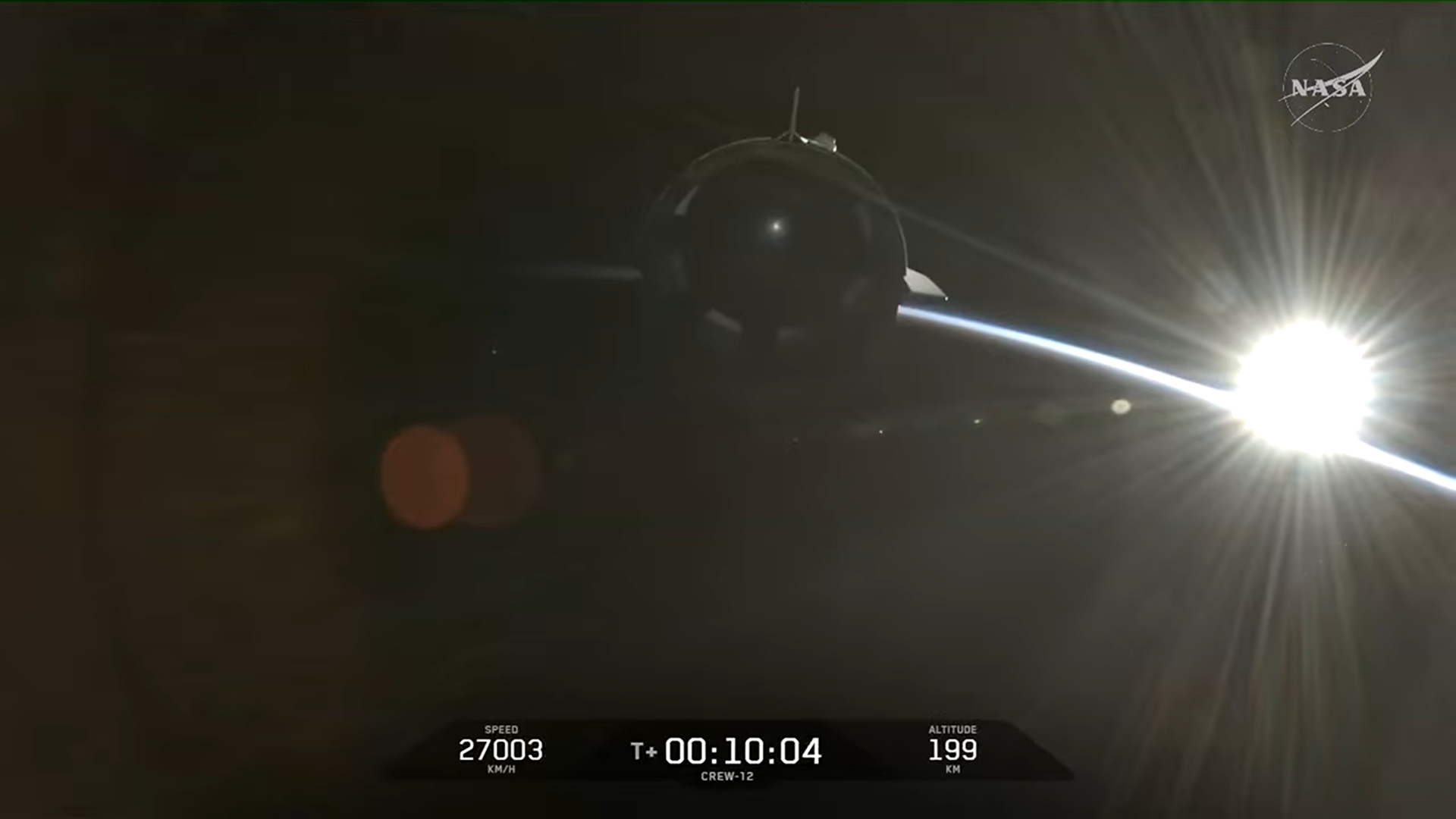 SpaceX Crew-12 Dragon flies free over the Earth during a sunrise