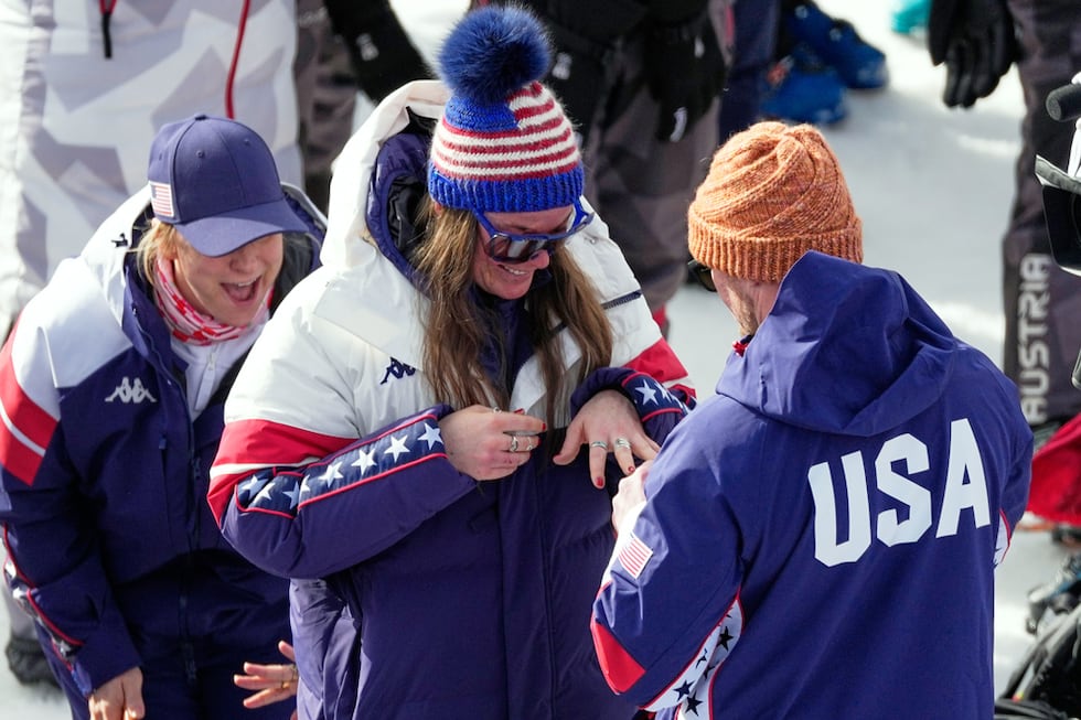 United States' Breezy Johnson looks at the engagement ring she was given by Connor Watkins, at...