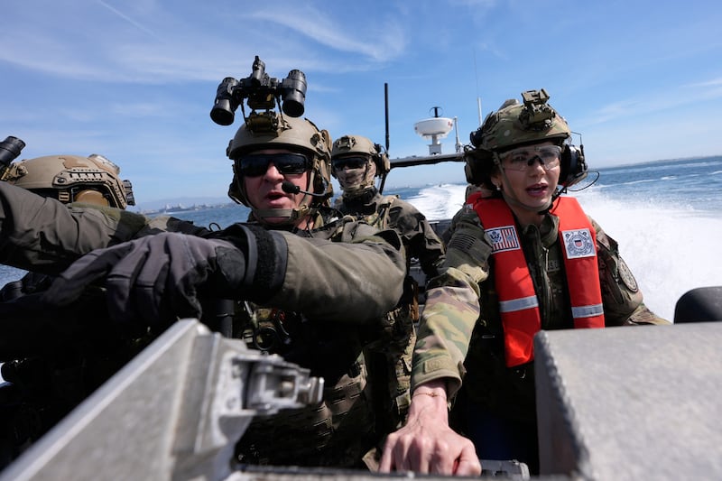 US Secretary of Homeland Security Kristi Noem (R) pilots a US Coast Guard Response Boat-Small (RBS) with the Maritime Security Response Team in San Diego, California, on March 16, 2025. (Photo by Alex Brandon / POOL / AFP) (Photo by ALEX BRANDON/POOL/AFP via Getty Images)