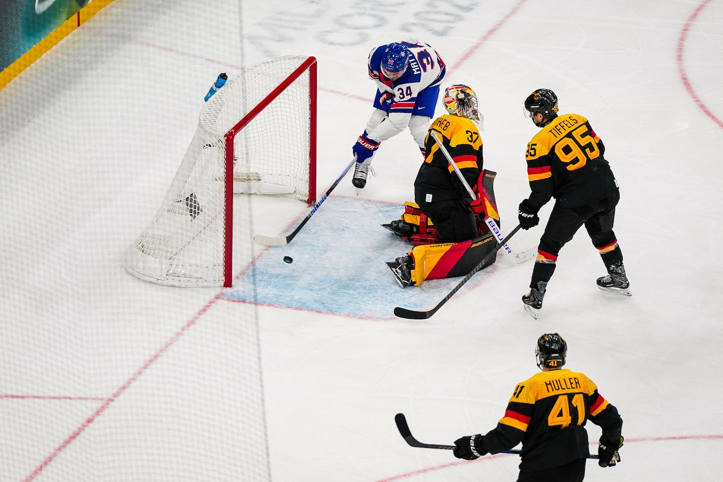 US captain Auston Matthews pounds the puck into an empty net behind German netminder Maximilian Franzreb to cap the scoring in the Americans' 5-1 victory Sunday.