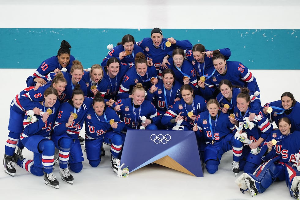 Team United States players pose together after receiving their gold medals after the women's...