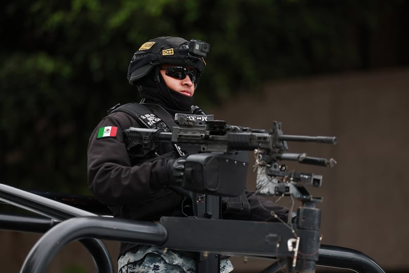 MEXICO CITY, MEXICO - FEBRUARY 22: Members of the National Guard stand guard outside the facilities of the Specialized Prosecutor's Office for Organized Crime (FEMDO) in Mexico City, Mexico on February 22, 2026. The security presence outside the FEMDO facilities follows an operation earlier in the day in which cartel leader Nemesio Oseguera Cervantes, known as 'El Mencho' was killed during a military operation in Tapalpa, in the state of Jalisco, authorities confirmed. (Photo by Daniel Cardenas/Anadolu via Getty Images)