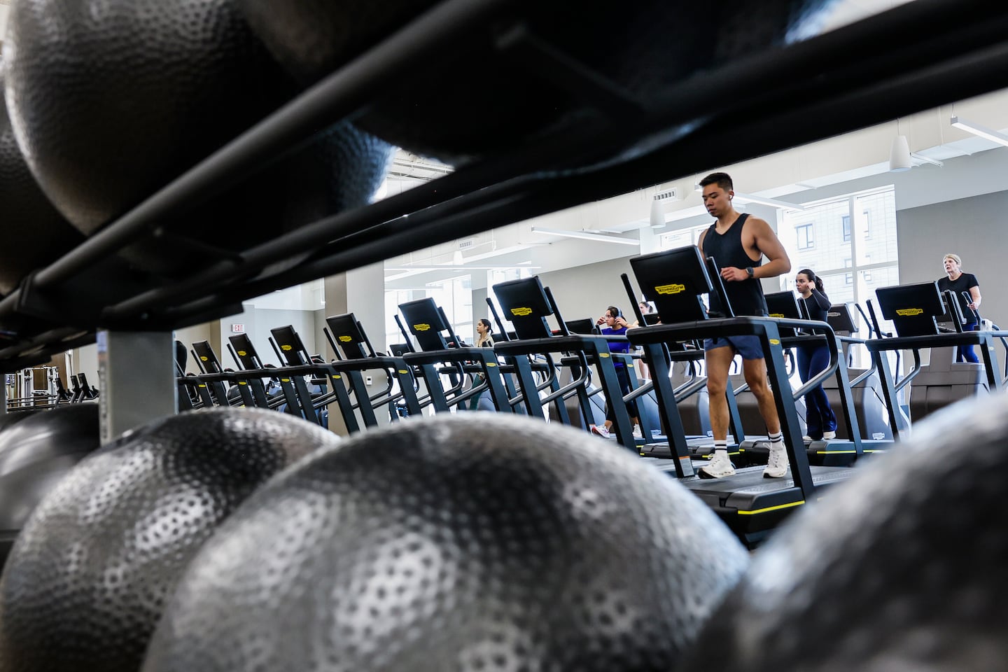 Gym members used treadmills on the cardio floor at the Life Time fitness club at the Prudential Center in Boston, on Jan. 23. Luxury gyms are expanding their footprint and equipment offerings as part of a broader effort to differentiate themselves from lower-cost fitness centers and justify higher membership prices.