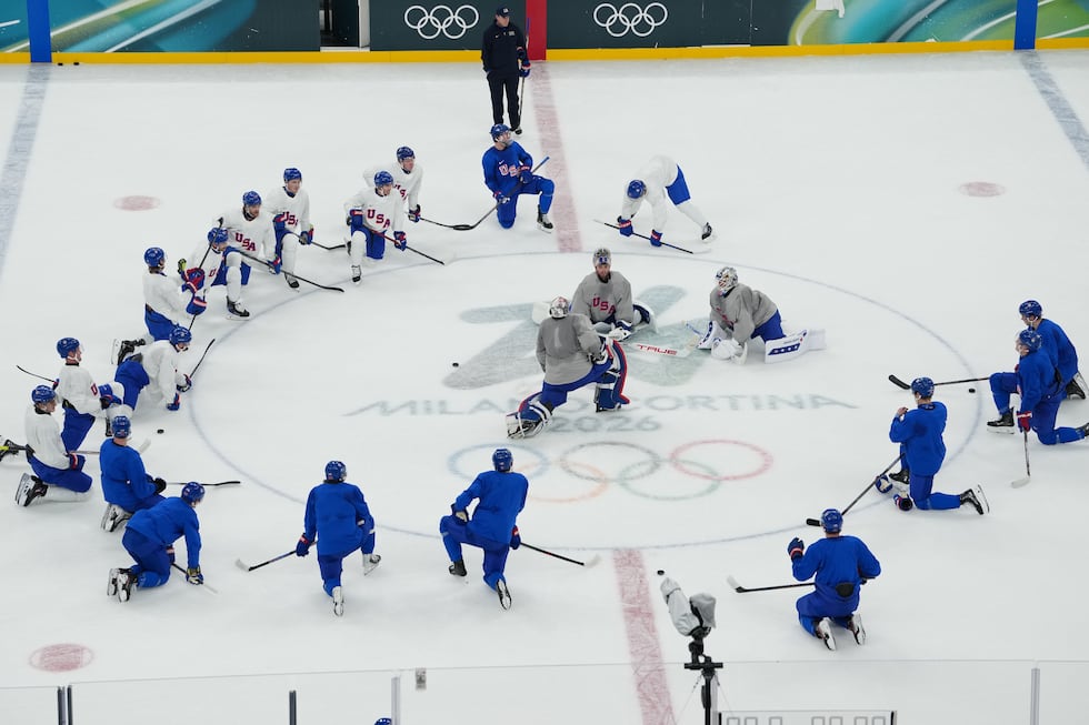 The United States men's ice hockey team gathers on the ice during practice at the 2026 Winter...