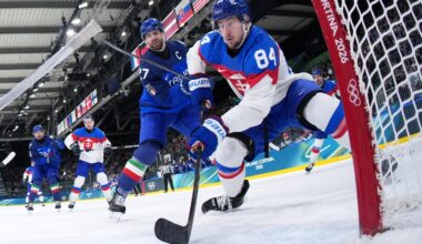 Thomas Larkin (left), shown challenging Slovakia's Pavol Regenda on Friday, was a fifth-round pick of the Blue Jackets in 2009 and played 147 games at Colgate, but never reached the NHL.