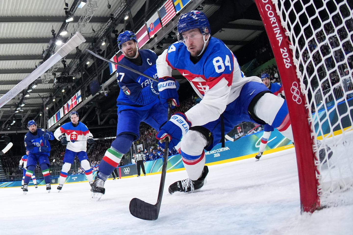Thomas Larkin (left), shown challenging Slovakia's Pavol Regenda on Friday, was a fifth-round pick of the Blue Jackets in 2009 and played 147 games at Colgate, but never reached the NHL.