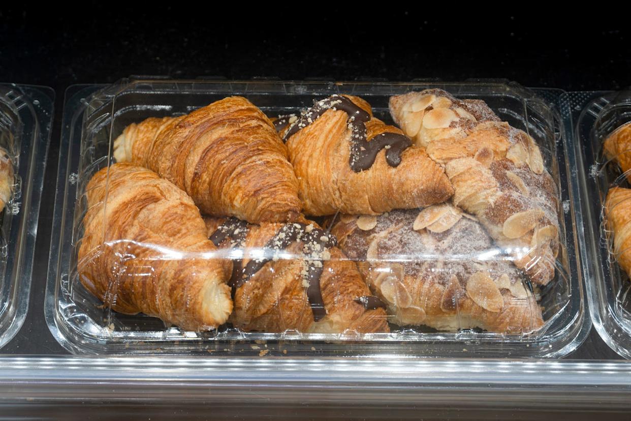 assorted croissants in a display case