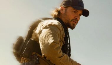 Luke Grimes looks at something off-screen