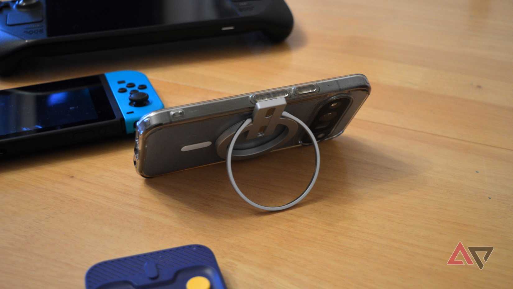 The Abxylute M4's ring being used as a stand.