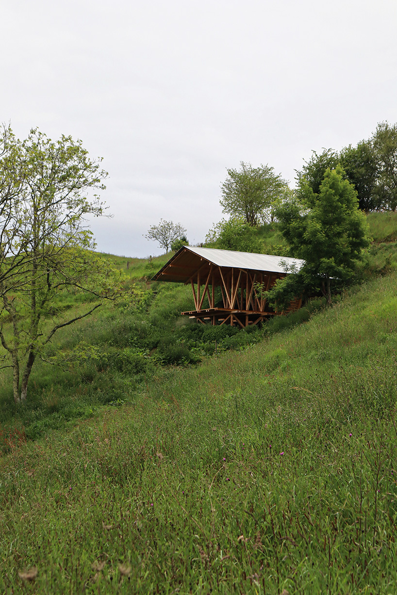 gabled timber observation pavilion promotes agroforestry in asturias, spain