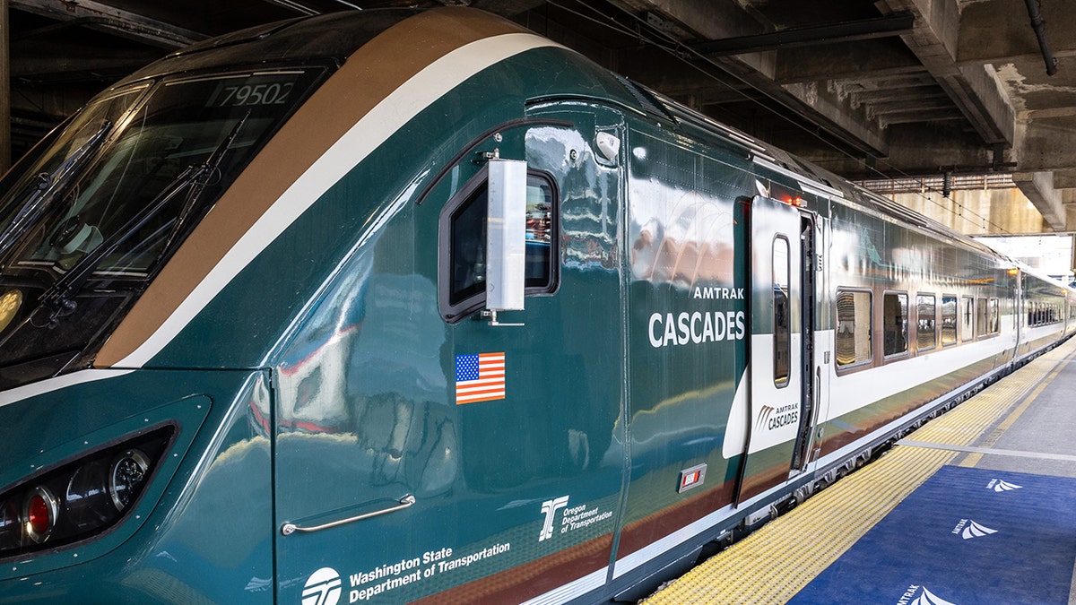 A new Amtrak Airo train sits in a station with 