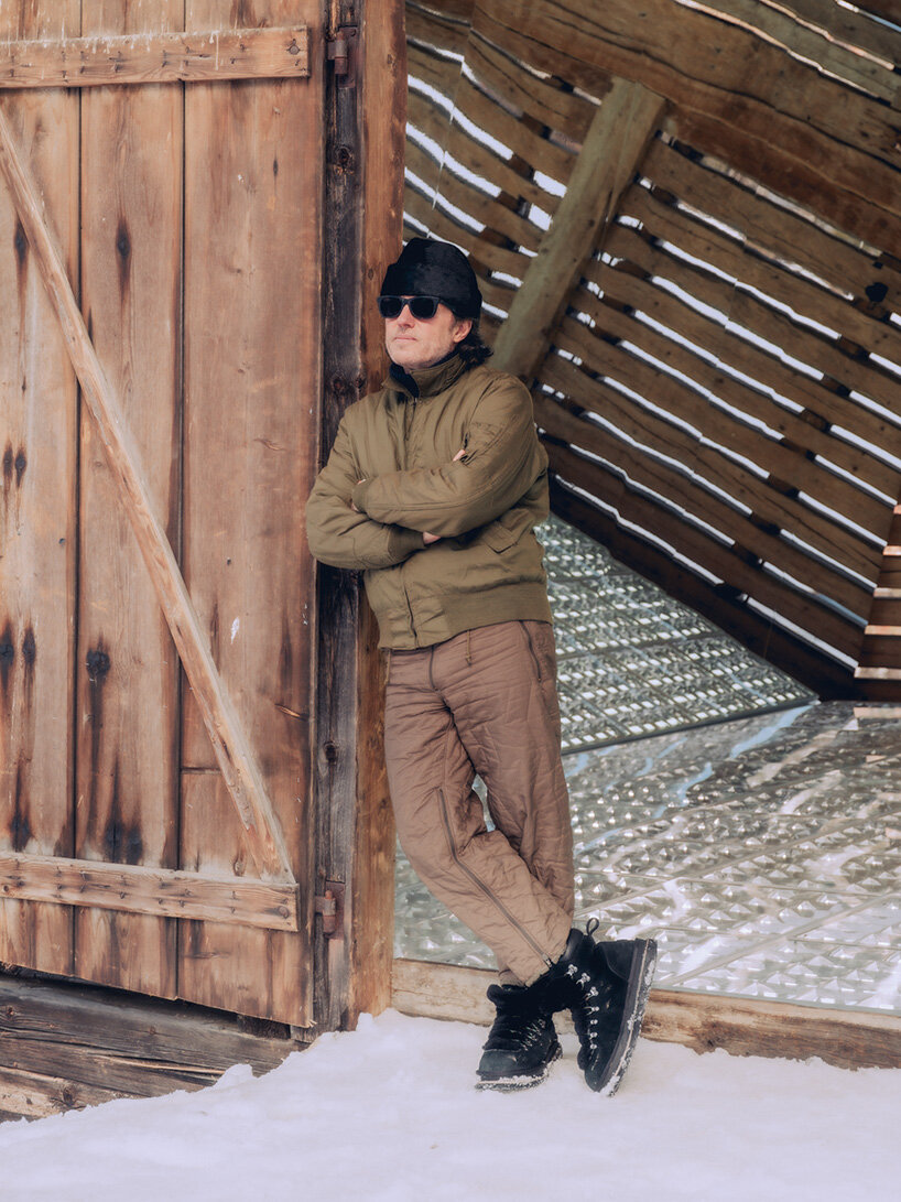 alexandre de betak inserts reflective light installation into traditional swiss barn