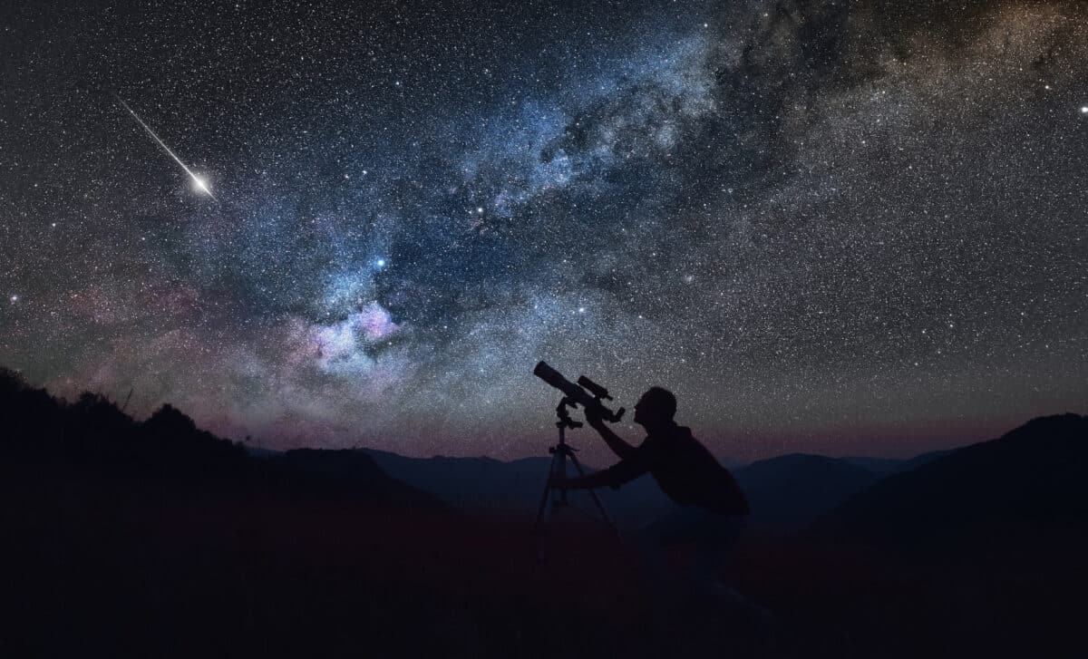 An Astronomer Looking At The Starry Skies With A Telescope.