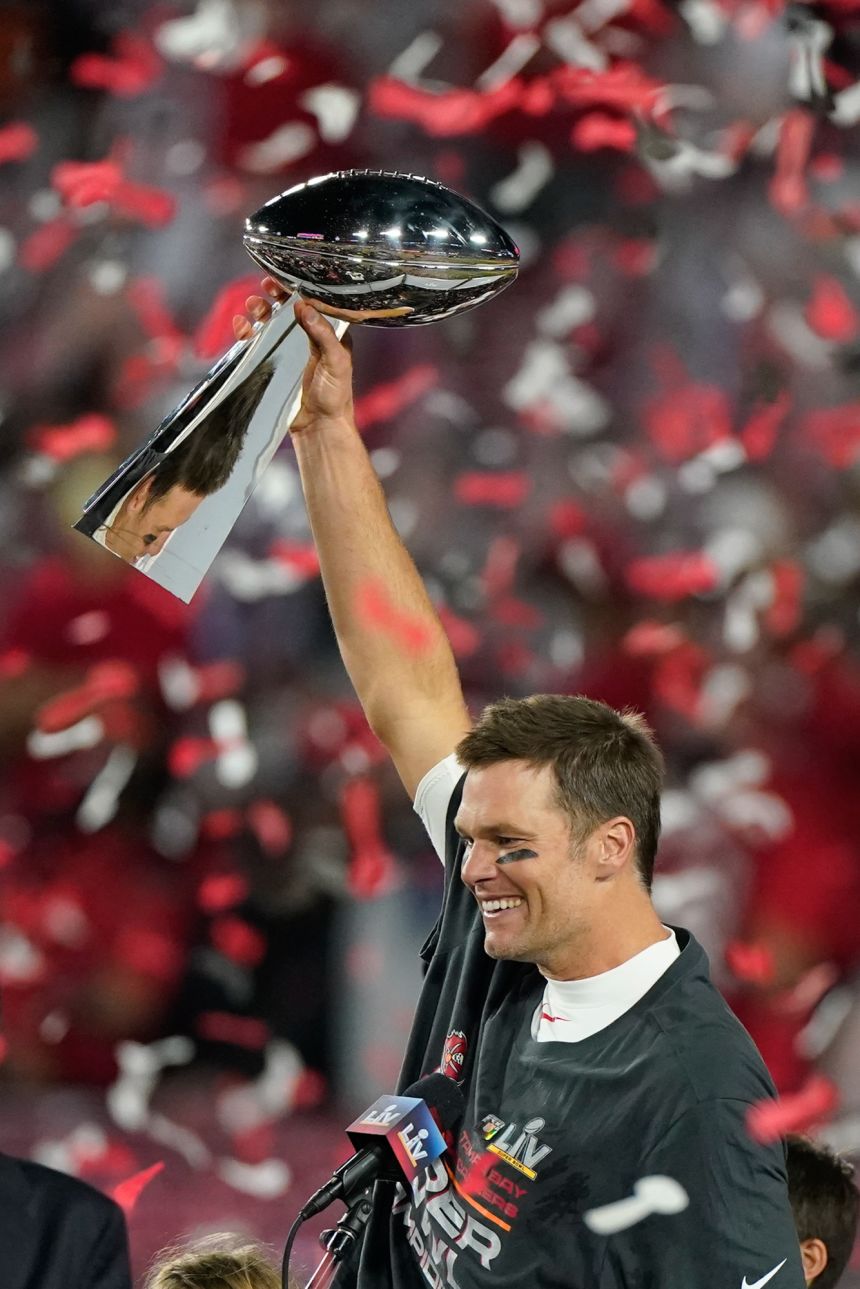 Tampa Bay Buccaneers quarterback Tom Brady celebrates with the Vince Lombardi Trophy after the NFL Super Bowl 55 football game against the Kansas City Chiefs on Feb. 7, 2021, in Tampa, Florida. The Buccaneers defeated the Chiefs 31-9 to win the Super Bowl.