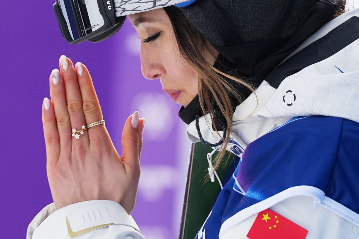 Chinese freestyle skier Eileen Gu celebrates her score in the slopestyle final on February 9. She finished with the silver.