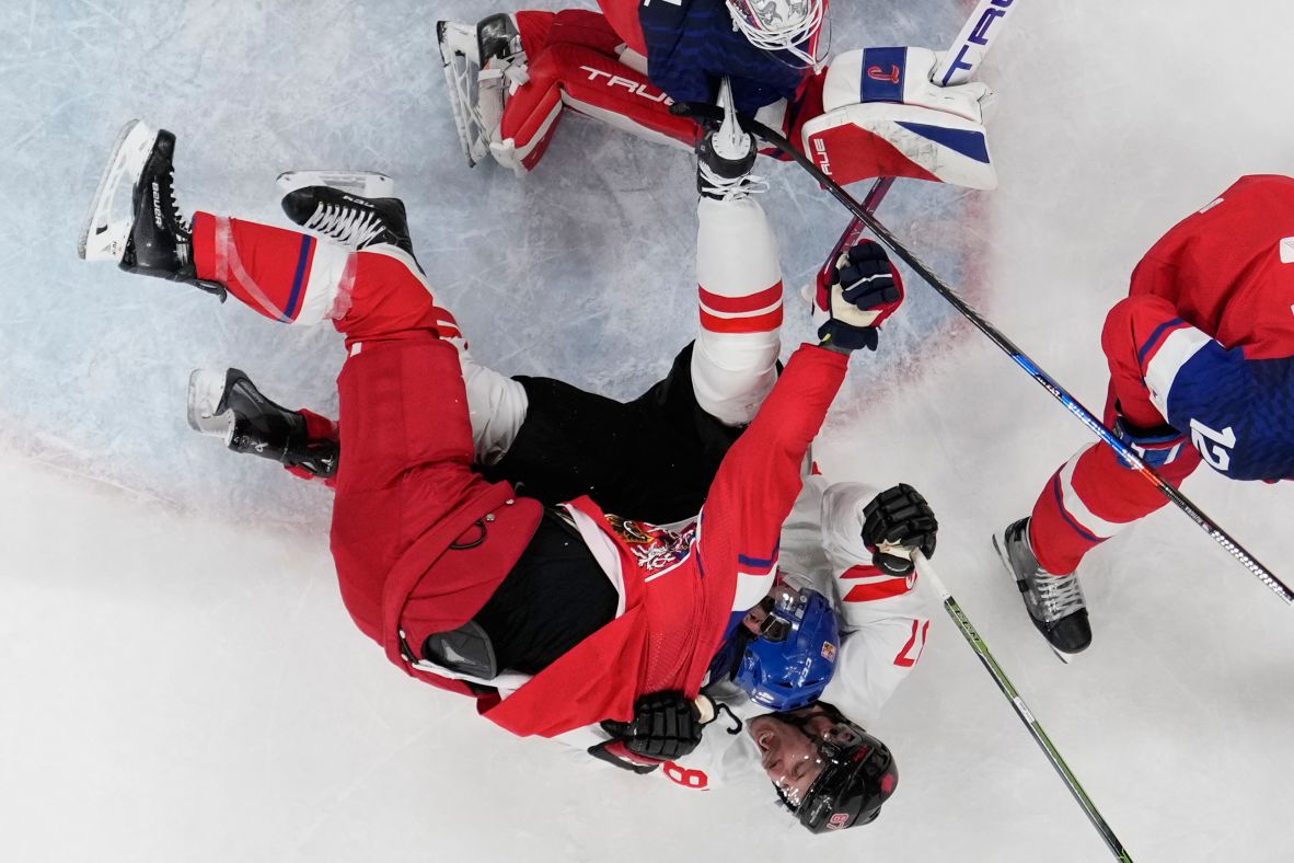 Canada’s Sidney Crosby and the Czech Republlc’s Jan Rutta tangle during a preliminary round hockey game on February 12.
