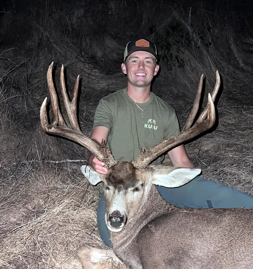 A California hunter with a nice mule deer buck.
