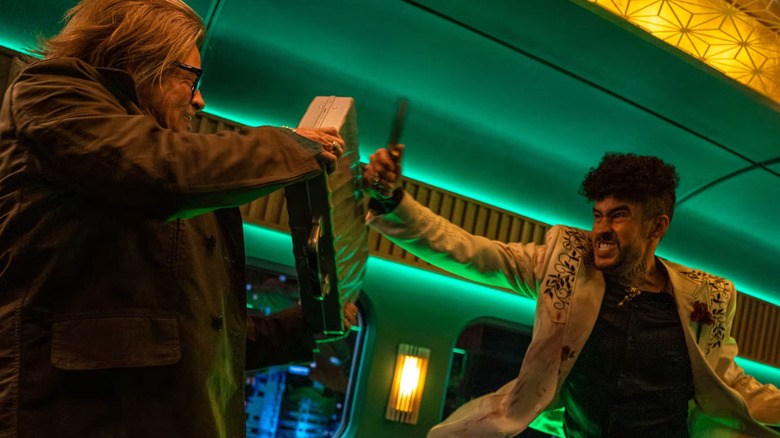 Wolf (Bad Bunny) and Ladybug (Brad Pitt) fighting each other in Bullet Train