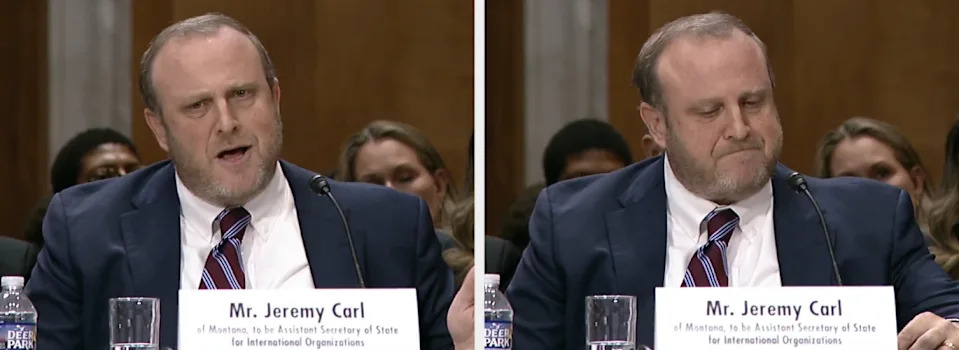 Man in a suit speaking and sitting with a serious expression during a formal hearing. Name placard reads "Mr. Jeremy Carl."