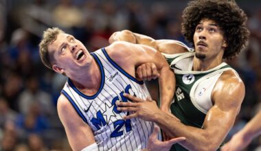 Orlando Magic forward/center Moritz Wagner, left, and Milwaukee Bucks center Jericho Sims fight for position on a rebound during the first half of an NBA basketball game, Wednesday, Feb. 11, 2026, in Orlando, Fla.