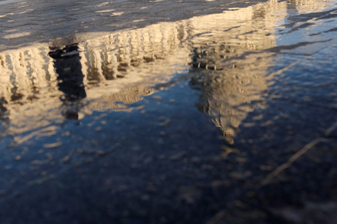 The US Capitol is reflected in water hours ahead of a press conference to discuss the Epstein Files Transparency Act on Capitol Hill in Washington, DC, on September 3, 2025.