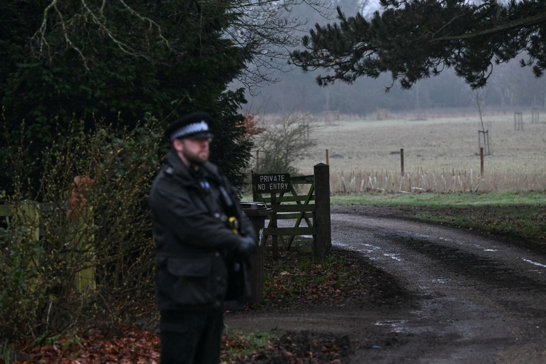 A policeman stands at an entrance to Wood Farm on the royal family's Sandringham Estate in Norfolk, eastern England on Thursday, where former prince Andrew was arrested earlier in the day.