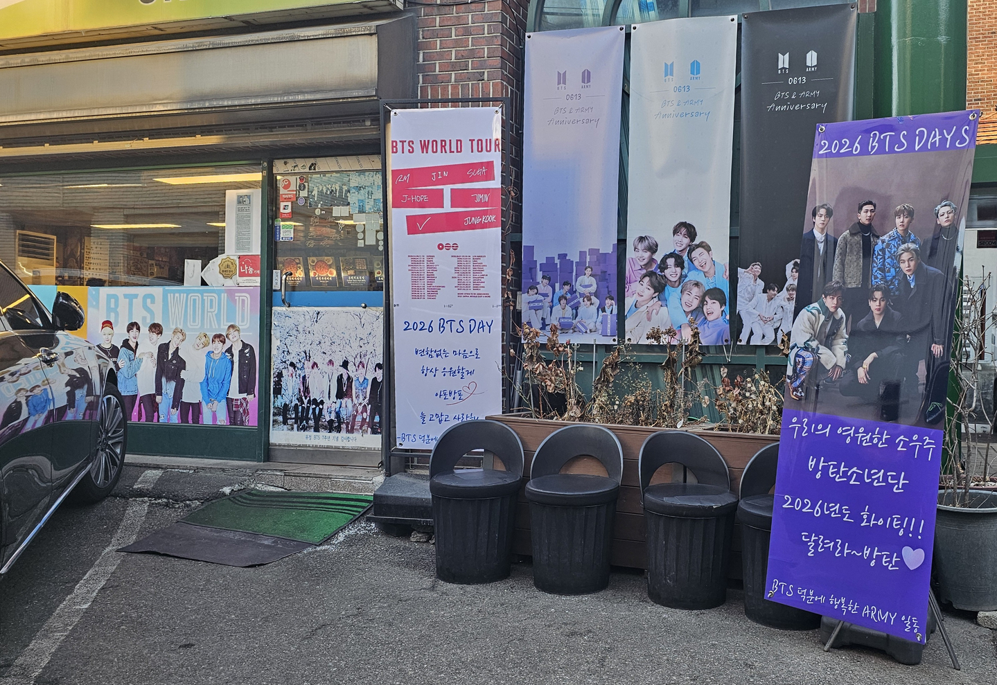 A banner supporting BTS's upcoming fifth full-length album, ″Arirang,″ stands outside Yoojung Sikdang in southern Seoul, known for being a restaurant which the BTS members frequented during their trainee days, on Feb. 19. [SHIN HA-NEE]