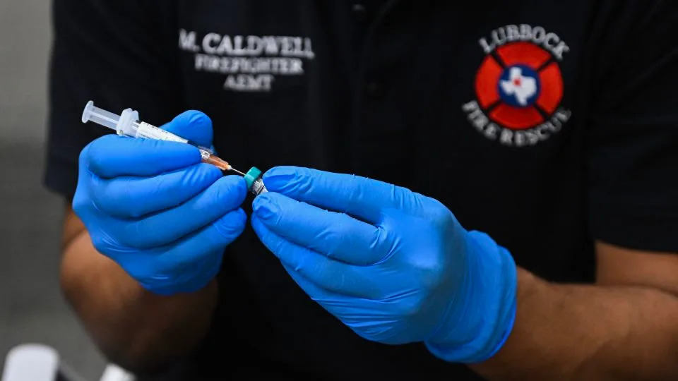 A paramedic administers a dose of the measles vaccine at a health center in Lubbock, Texas,  in February 2025, amid a large measles outbreak that led to the deaths of two children. - Ronaldo Schemidt/AFP/Getty Images