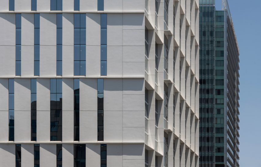 High-rise building with white external louvres