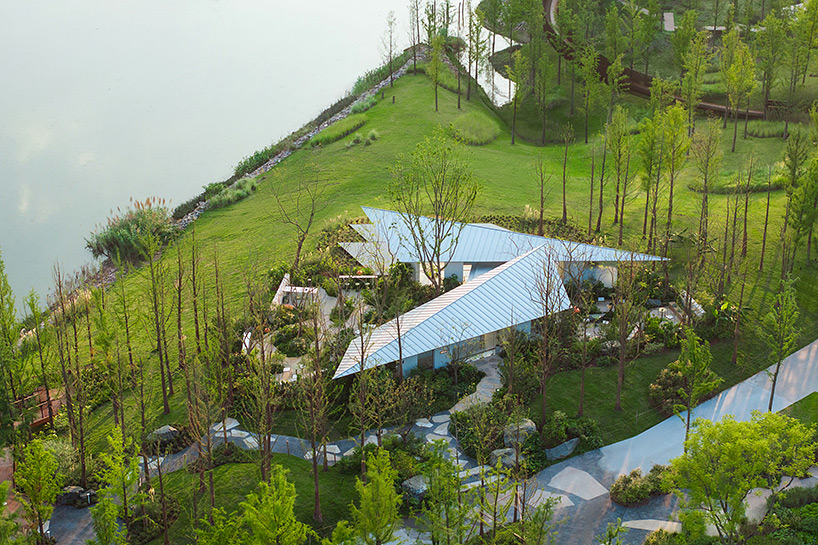 folded triangular roof planes shape café along china's yangtze river